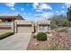 Charming single-level home with a desert-style front yard and two car garage at 12642 N Mountainside Dr # D, Fountain Hills, AZ 85268