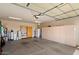 Spacious garage with built-in cabinets, a water softener, and ample storage space at 12642 N Mountainside Dr # D, Fountain Hills, AZ 85268