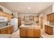 Spacious kitchen featuring light wood cabinets, tile countertops, and a central island at 12642 N Mountainside Dr # D, Fountain Hills, AZ 85268