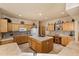 Well-lit kitchen with tile countertops, an island cooktop, and abundant cabinet space at 12642 N Mountainside Dr # D, Fountain Hills, AZ 85268