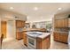 Open kitchen with island cooktop, wrap around countertops and direct access to dining area at 12642 N Mountainside Dr # D, Fountain Hills, AZ 85268