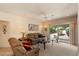 Comfortable living area featuring a ceiling fan and sliding glass doors for natural light at 12642 N Mountainside Dr # D, Fountain Hills, AZ 85268