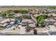 Expansive aerial view of a neighborhood with homes featuring solar panels and well-maintained landscaping at 14161 W Poinsettia Dr, Surprise, AZ 85379
