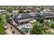 An aerial view features a pool, covered patio area, and backyard landscaping at 14161 W Poinsettia Dr, Surprise, AZ 85379