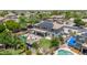 Aerial view of the backyard includes a pool, covered patio, and well-maintained grass at 14161 W Poinsettia Dr, Surprise, AZ 85379
