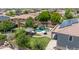 The aerial view showcases the backyard with a pool, cabana, and covered patio area at 14161 W Poinsettia Dr, Surprise, AZ 85379