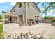 Expansive backyard with a covered patio, outdoor kitchen, and a lush lawn at 14161 W Poinsettia Dr, Surprise, AZ 85379