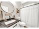 Bathroom featuring a granite countertop, modern fixtures, and toilet at 14161 W Poinsettia Dr, Surprise, AZ 85379