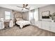 Bedroom with a cozy bed, natural lighting, and a dresser for ample storage at 14161 W Poinsettia Dr, Surprise, AZ 85379