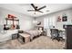 Unique bedroom featuring fun decor and plenty of space for work and relaxation at 14161 W Poinsettia Dr, Surprise, AZ 85379
