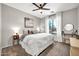 Bright bedroom featuring a large window with natural light and neutral decor at 14161 W Poinsettia Dr, Surprise, AZ 85379