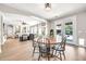 Open dining area with seating for six and a view into the living room at 14161 W Poinsettia Dr, Surprise, AZ 85379