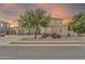 Charming two-story home with well-manicured landscaping, inviting curb appeal, and a welcoming entrance at 14161 W Poinsettia Dr, Surprise, AZ 85379