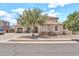 Charming two-story home featuring a well-manicured yard, neutral color palette, and a convenient two-car garage at 14161 W Poinsettia Dr, Surprise, AZ 85379