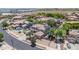 Aerial view showcases the house's front and street in a well-kept neighborhood at 14161 W Poinsettia Dr, Surprise, AZ 85379