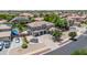 The aerial view highlights the home's front, landscaping, and long drive at 14161 W Poinsettia Dr, Surprise, AZ 85379
