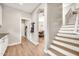 Hallway provides seamless flow between rooms with sightlines to stairs and storage at 14161 W Poinsettia Dr, Surprise, AZ 85379