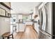 Charming kitchen with stainless steel appliances and an adjacent door leading to the yard at 14161 W Poinsettia Dr, Surprise, AZ 85379