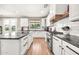 Bright kitchen features stainless steel appliances, granite counters and stylish subway tile backsplash at 14161 W Poinsettia Dr, Surprise, AZ 85379
