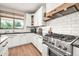 Kitchen featuring white cabinets, granite countertops, and stainless steel appliances at 14161 W Poinsettia Dr, Surprise, AZ 85379