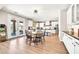 Open concept: A dining area blends seamlessly with a modern kitchen at 14161 W Poinsettia Dr, Surprise, AZ 85379