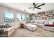 Comfortable living room featuring a large sectional couch and natural lighting, perfect for relaxation at 14161 W Poinsettia Dr, Surprise, AZ 85379