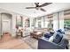 Inviting living room with comfortable seating, a ceiling fan, and neutral tones at 14161 W Poinsettia Dr, Surprise, AZ 85379