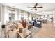 Bright living room with comfortable seating, an open floor plan, and seamless access to the kitchen at 14161 W Poinsettia Dr, Surprise, AZ 85379