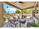 Expansive outdoor living space with seating, grilling area, and pool views for entertaining guests at 14161 W Poinsettia Dr, Surprise, AZ 85379