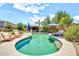 Beautiful backyard pool with a gazebo, lounge chairs, and lush landscaping at 14161 W Poinsettia Dr, Surprise, AZ 85379