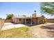 Spacious backyard featuring a covered patio, perfect for outdoor relaxation and entertaining at 1454 W Capri Ave, Mesa, AZ 85202