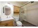 Well-maintained bathroom featuring a glass shower, vanity with sink, and cabinet at 1454 W Capri Ave, Mesa, AZ 85202