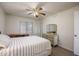 Comfortable bedroom with wood floors, a window, and a classic dresser with a mirror at 1454 W Capri Ave, Mesa, AZ 85202