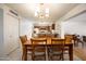 Traditional dining space with wood table, tile flooring, and open view to the kitchen at 1454 W Capri Ave, Mesa, AZ 85202