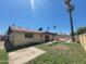 Backyard with a pool covered, grass, palm trees, and a fenced yard at 15602 N 55Th Ave, Glendale, AZ 85306