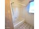 A bathtub with a showerhead and a window that provides natural lighting at 15602 N 55Th Ave, Glendale, AZ 85306