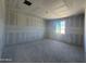 Spacious bedroom under construction with drywall and one window, featuring recessed lighting and smooth concrete flooring at 16174 W Bajada Rd, Surprise, AZ 85387