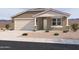 Charming single-story home with a stucco exterior, well-maintained landscaping, and an attached two-car garage at 16174 W Bajada Rd, Surprise, AZ 85387