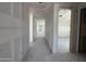 Long hallway with drywall installed, leading to spacious rooms, and featuring smooth, gray concrete floors at 16174 W Bajada Rd, Surprise, AZ 85387