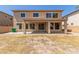 A view of the home's backyard, highlighting the covered patio and offering ample space for outdoor activities and relaxation at 17419 W Elaine Dr, Goodyear, AZ 85338