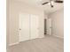 Bedroom with carpet flooring, sliding closet doors and ceiling fan at 17419 W Elaine Dr, Goodyear, AZ 85338