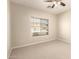 Bedroom with carpet flooring, ceiling fan and a bright window at 17419 W Elaine Dr, Goodyear, AZ 85338