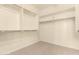Walk-in closet with built in shelving at 17419 W Elaine Dr, Goodyear, AZ 85338