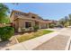 Charming two-story home featuring a well-manicured lawn and a two-car garage at 17419 W Elaine Dr, Goodyear, AZ 85338
