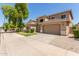 Charming two-story home featuring a well-manicured lawn and a two-car garage at 17419 W Elaine Dr, Goodyear, AZ 85338