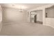 Spacious living room featuring neutral carpet, chandelier, and open layout at 17419 W Elaine Dr, Goodyear, AZ 85338