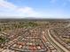 Aerial view of a home outlined in red, near a golf course and canal at 18119 W Spencer Dr, Surprise, AZ 85374