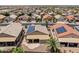 Aerial view of a home with solar panels surrounded by a vibrant neighborhood at 18119 W Spencer Dr, Surprise, AZ 85374