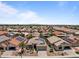A neighborhood shot with solar panels and well-maintained landscaping under a bright, clear sky at 18119 W Spencer Dr, Surprise, AZ 85374