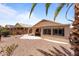 Backyard featuring a covered patio and a low maintenance gravel landscape at 18119 W Spencer Dr, Surprise, AZ 85374